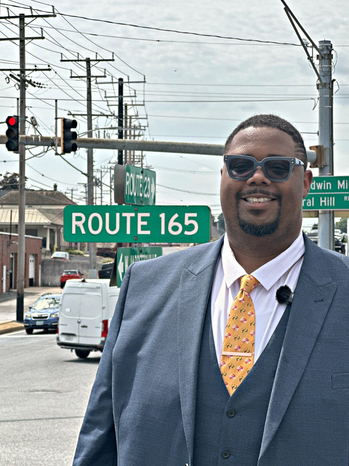 Michael Eckels Jr., candidate for Maryland House of Delegates District 35A, in a blue suit at the Route 165 and Route 23 junction in Jarrettsville, Harford County